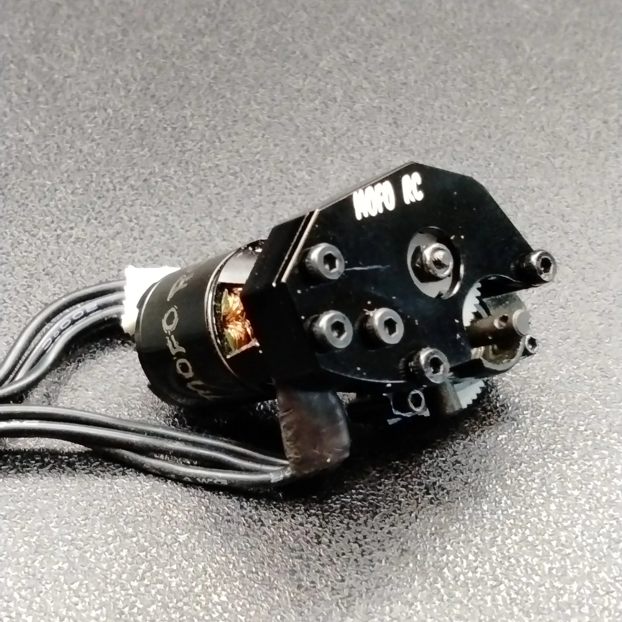 thumbnail interactive-video image 1 of KC Racing Brushless Adjustable Motor Mount For Flexi 1/24 Slot Cars (KCR-MUAO) 1 of 3